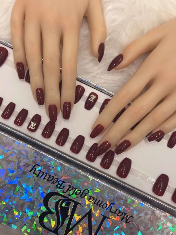 maroon coffin with crystal