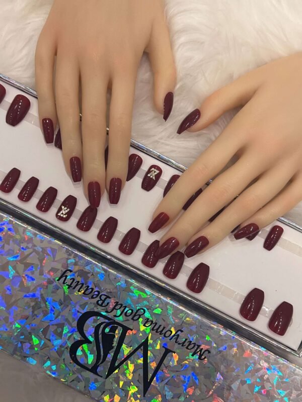 maroon coffin with crystal