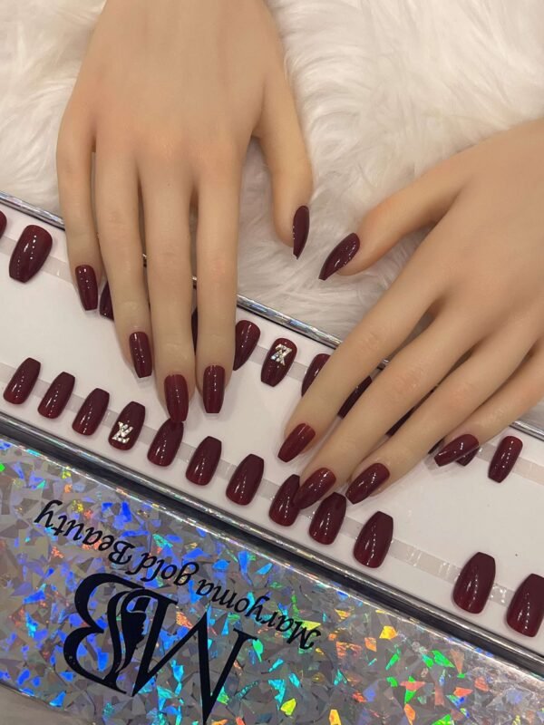 maroon coffin with crystal