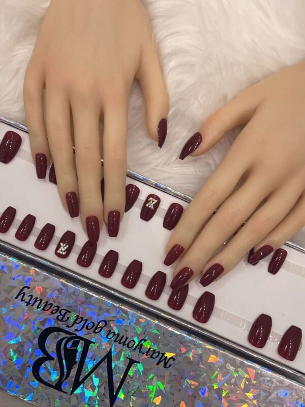 maroon coffin with crystal